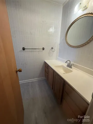 a bathroom with a sink and mirror
