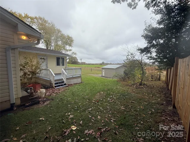 a view of a backyard of the house