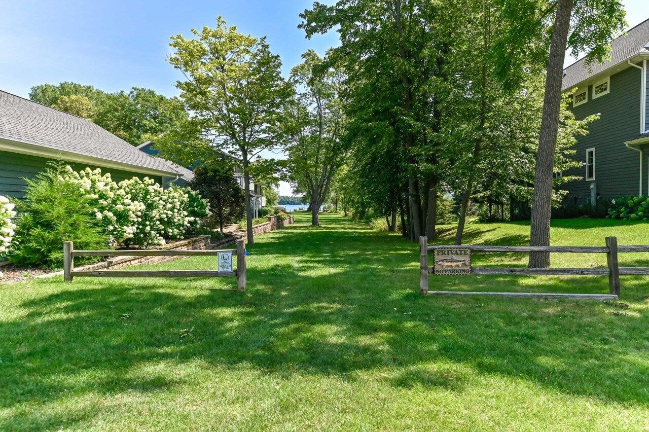 2135 West Shore Drive Delafield, WI 53018 - Photo 38 of 49 Access to pier - summer