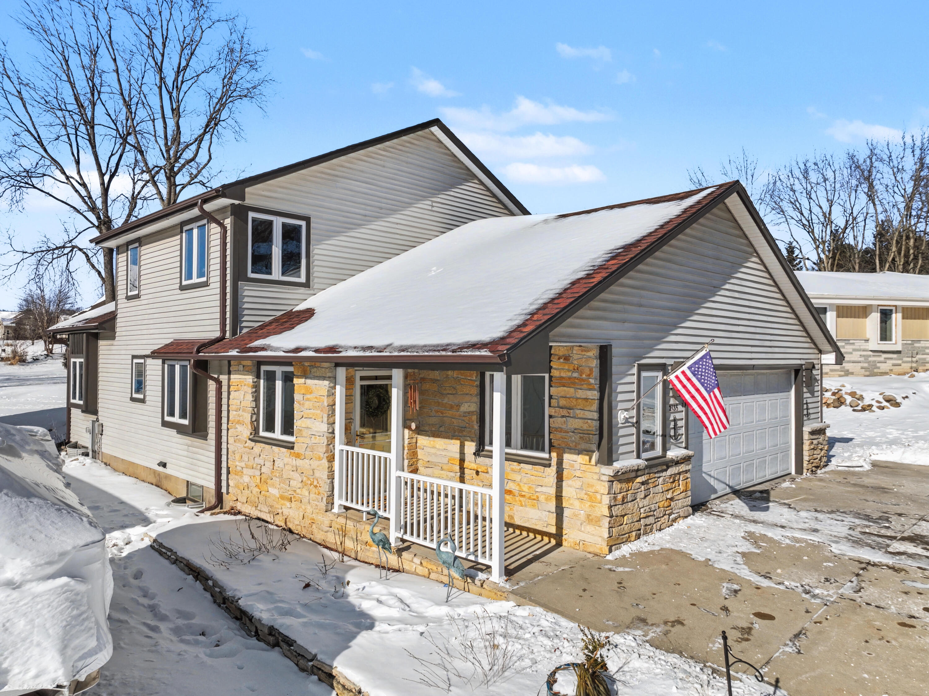 2135 West Shore Drive Delafield, WI 53018 - Photo 4 of 49 Low maintenance exterior