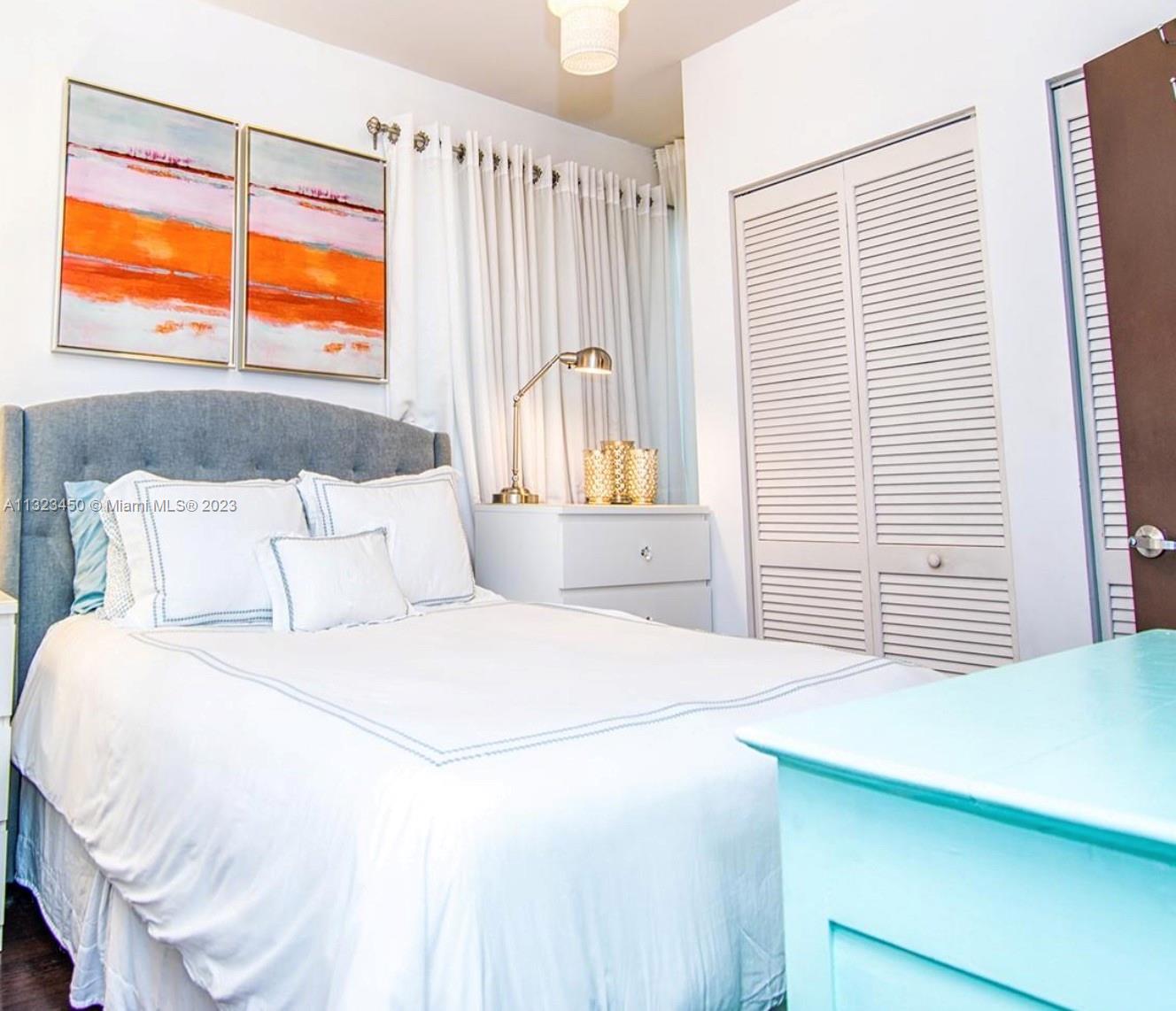 435 21st Street, Unit 223 Miami Beach, FL 33139 - Photo 6 of 6 a bedroom with a bed and a window