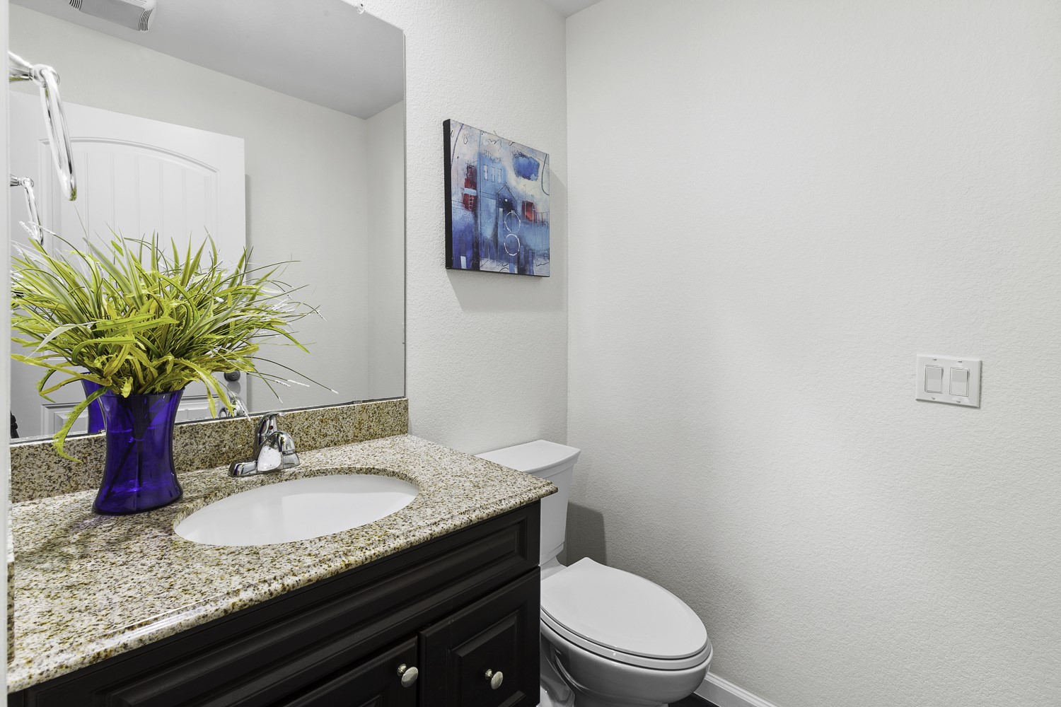 Undisclosed Address Austin, TX 78747 - Photo 10 of 28 a bathroom with a granite countertop toilet sink and mirror