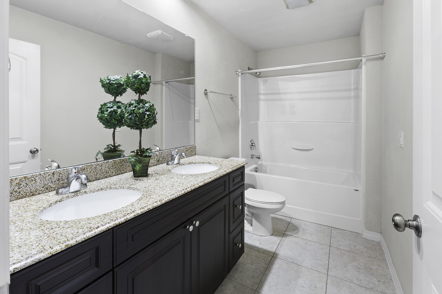 Undisclosed Address Austin, TX 78747 - Photo 22 of 28 a bathroom with a granite countertop sink a toilet and shower
