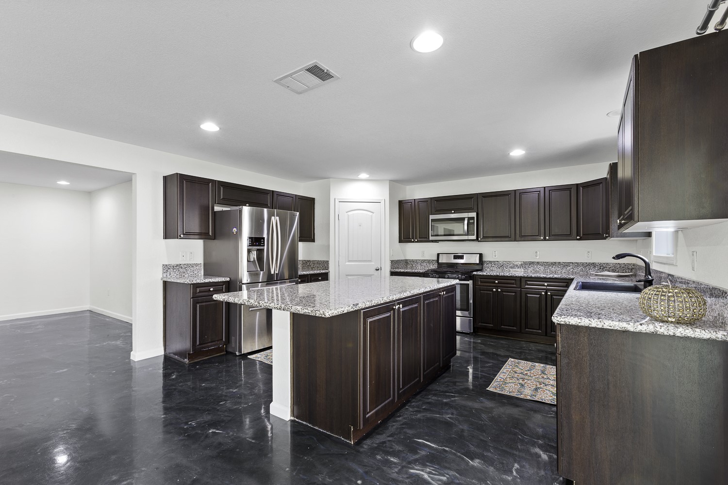 Undisclosed Address Austin, TX 78747 - Photo 3 of 28 a large kitchen with stainless steel appliances lots of counter top space