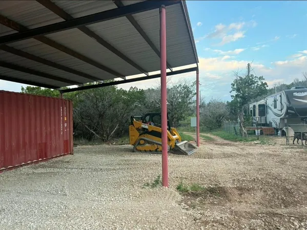 a view of a barn in a yard