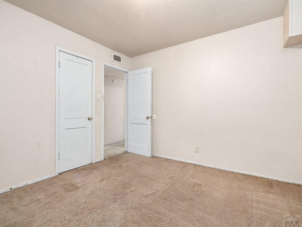 2610 Azalea Street Pueblo, CO 81005 - Photo 13 of 19 a view of an empty room