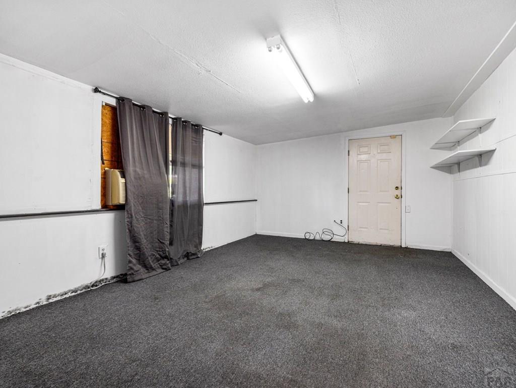 2610 Azalea Street Pueblo, CO 81005 - Photo 15 of 19 an empty room with closet