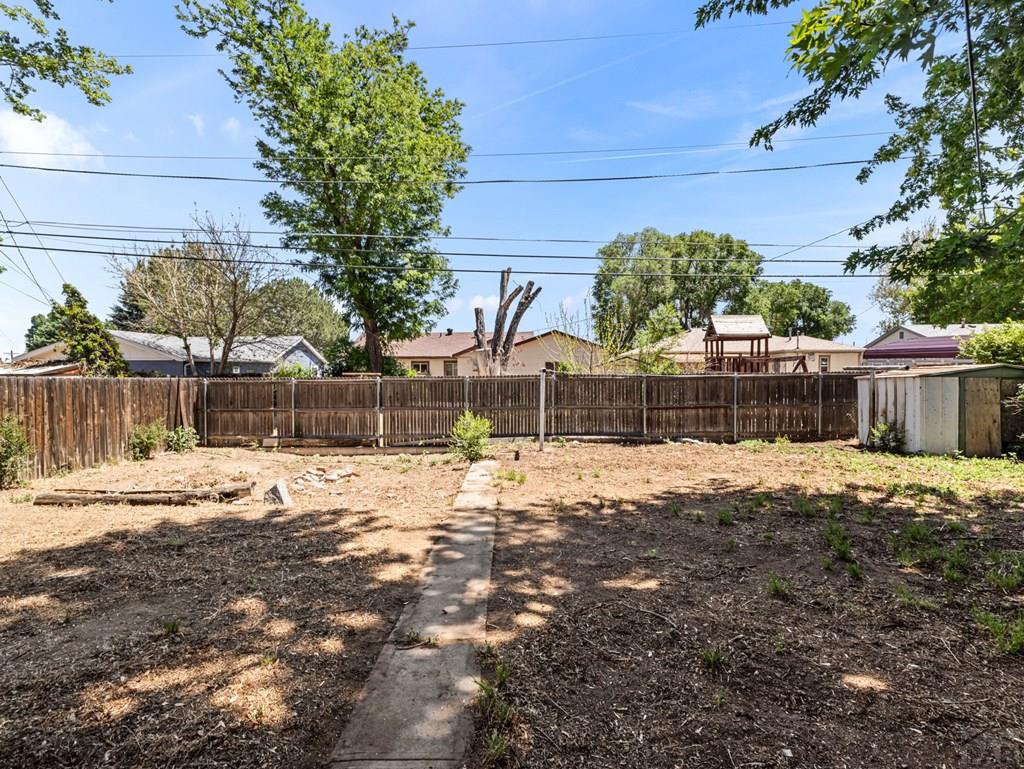 2610 Azalea Street Pueblo, CO 81005 - Photo 17 of 19 a view of a backyard of the house