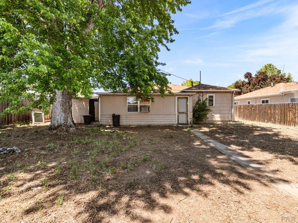 2610 Azalea Street Pueblo, CO 81005 - Photo 18 of 19 a view of a house with a yard