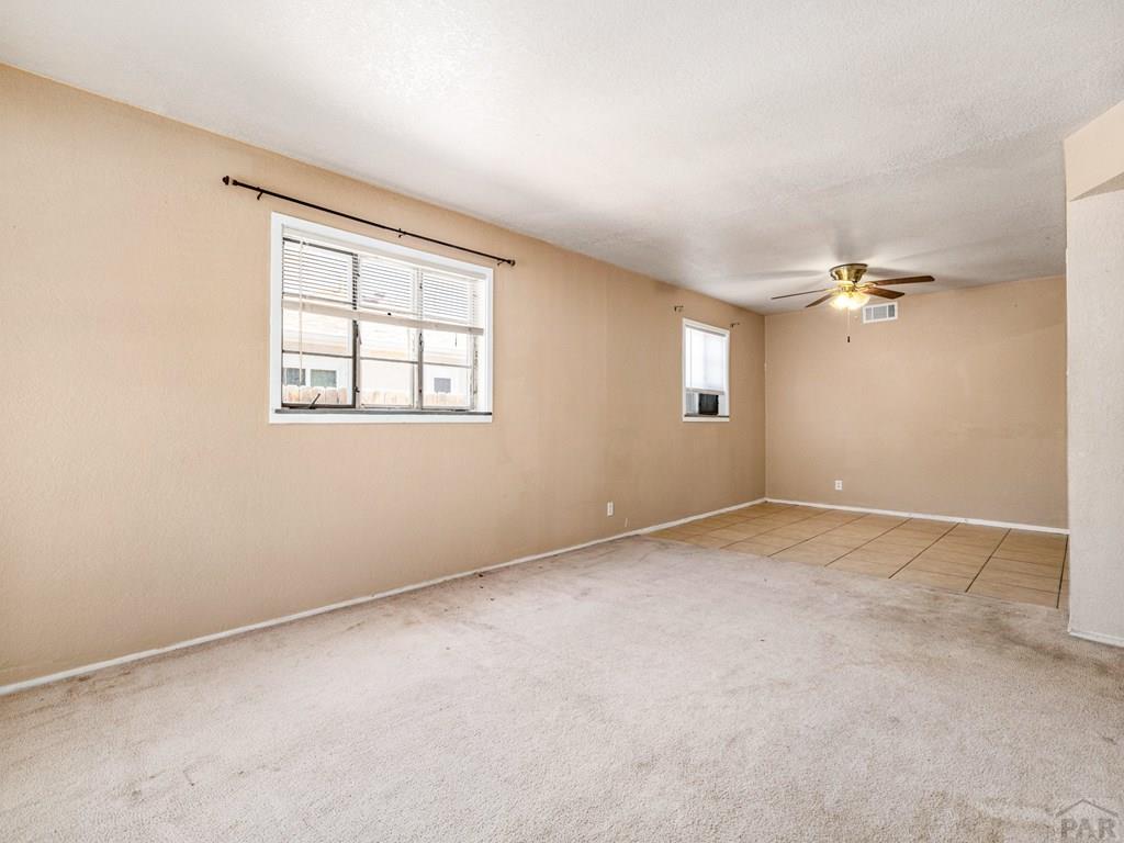 2610 Azalea Street Pueblo, CO 81005 - Photo 3 of 19 an empty room with windows and closet