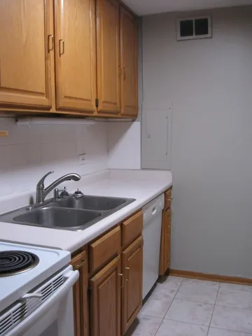 a kitchen with a sink and cabinets