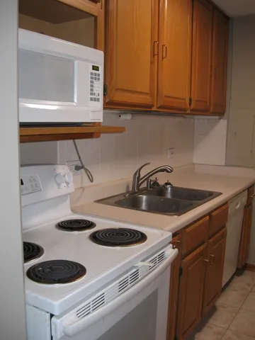 a view of storage and utility room with a cabinet