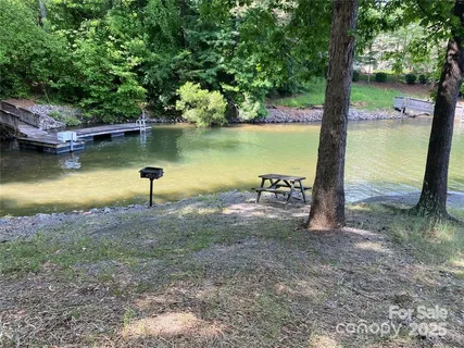 a view of a lake with a yard