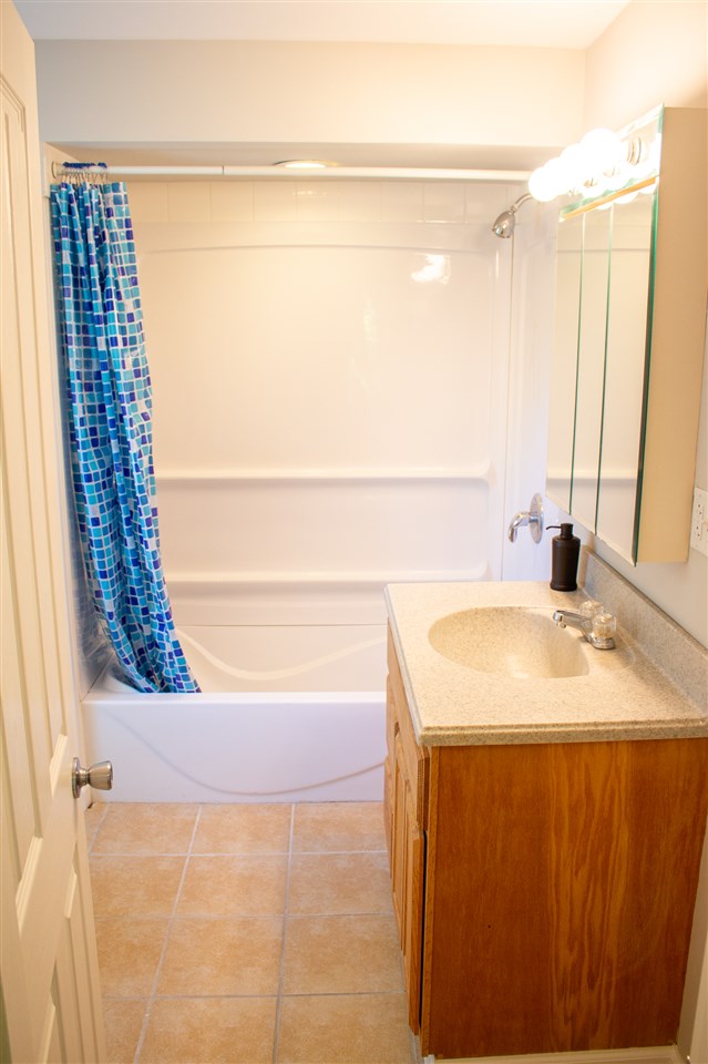 2017 Rural Street Rockford, IL 61107 - Photo 14 of 21 a bathroom with a sink and a shower