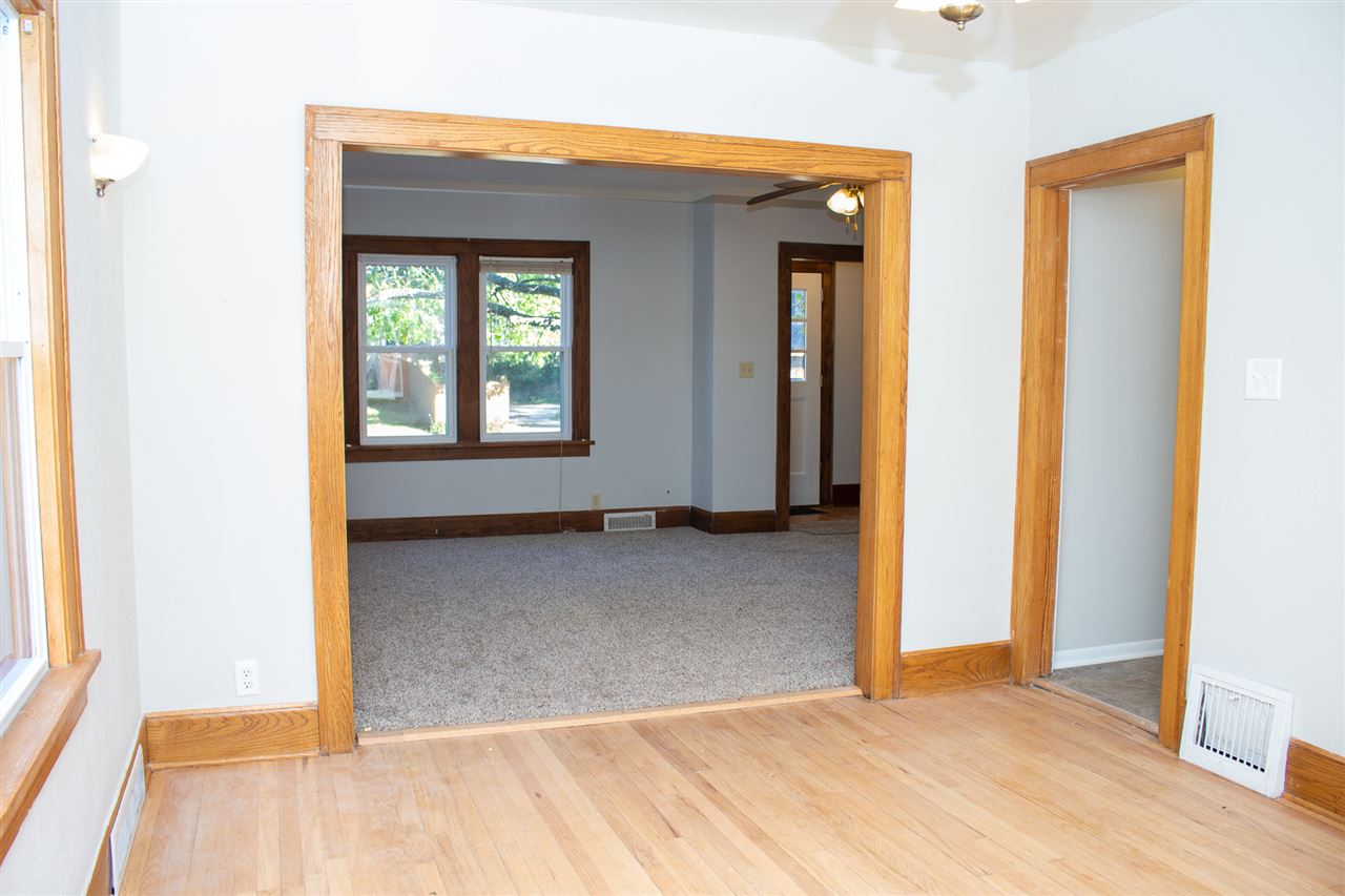 2017 Rural Street Rockford, IL 61107 - Photo 6 of 21 a view of an empty room with wooden floor and a window