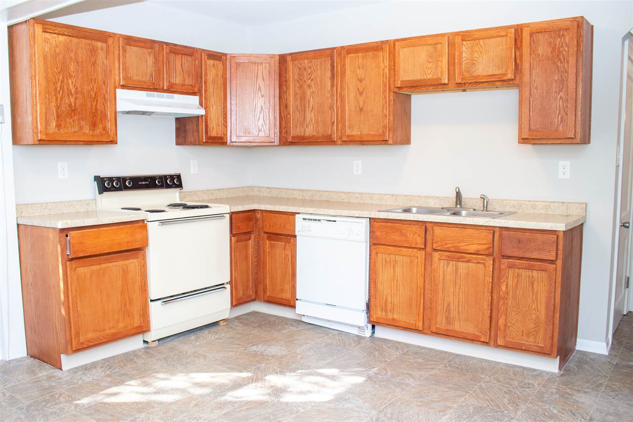 2017 Rural Street Rockford, IL 61107 - Photo 7 of 21 a kitchen with a sink stove and cabinets