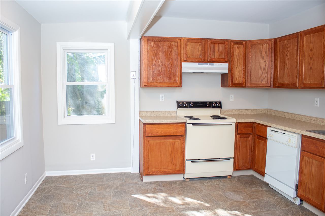 2017 Rural Street Rockford, IL 61107 - Photo 8 of 21 a kitchen with stainless steel appliances granite countertop a stove a sink and a microwave