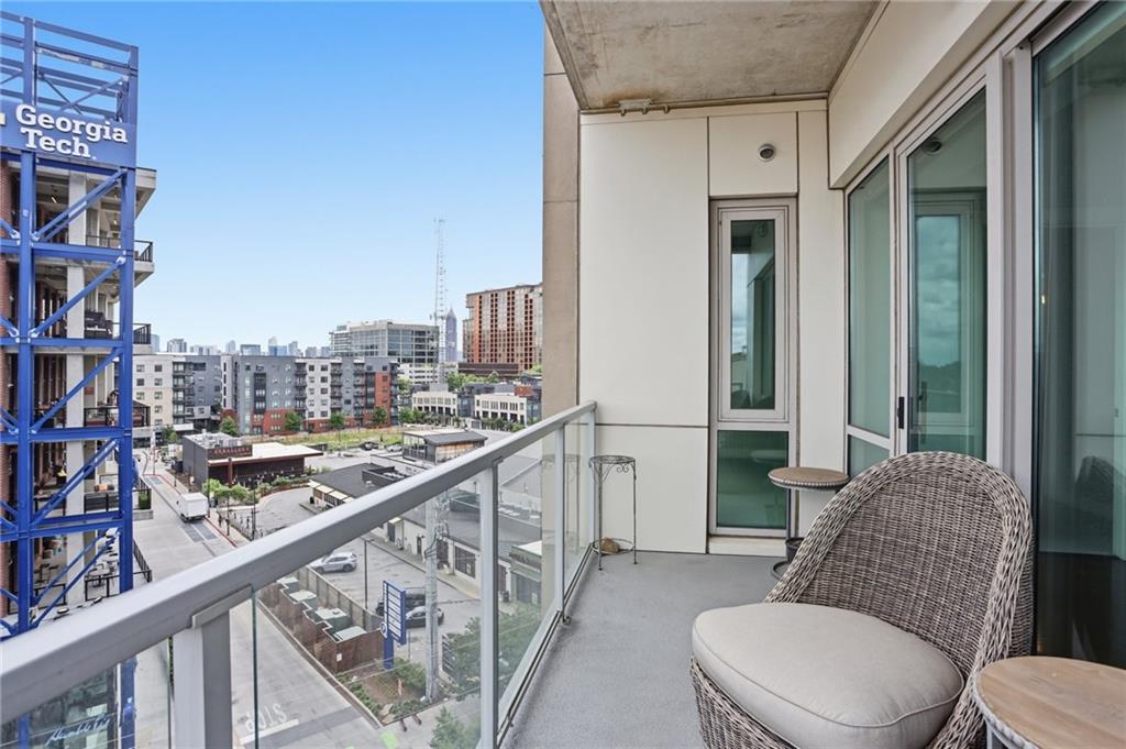 1100 Howell Mill Road Northwest, Unit 608 Atlanta, GA 30318 - Photo 12 of 37 a view of a balcony with furniture