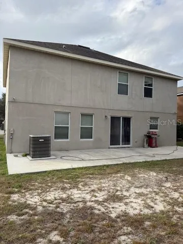 a view of swimming pool with a chair