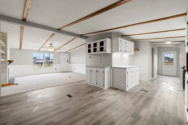 a view of kitchen with furniture and wooden floor