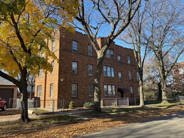 a view of a building with a street