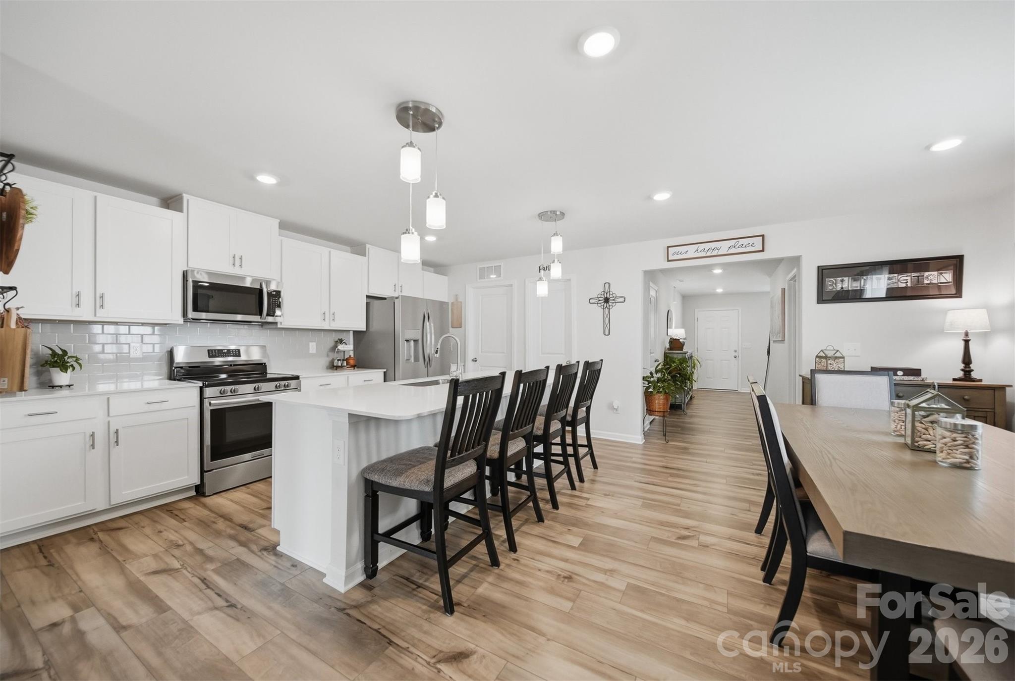 2841 Legacy Rdg Lane Catawba, NC 28609 - Photo 11 of 42 a large kitchen with kitchen island a dining table and chairs
