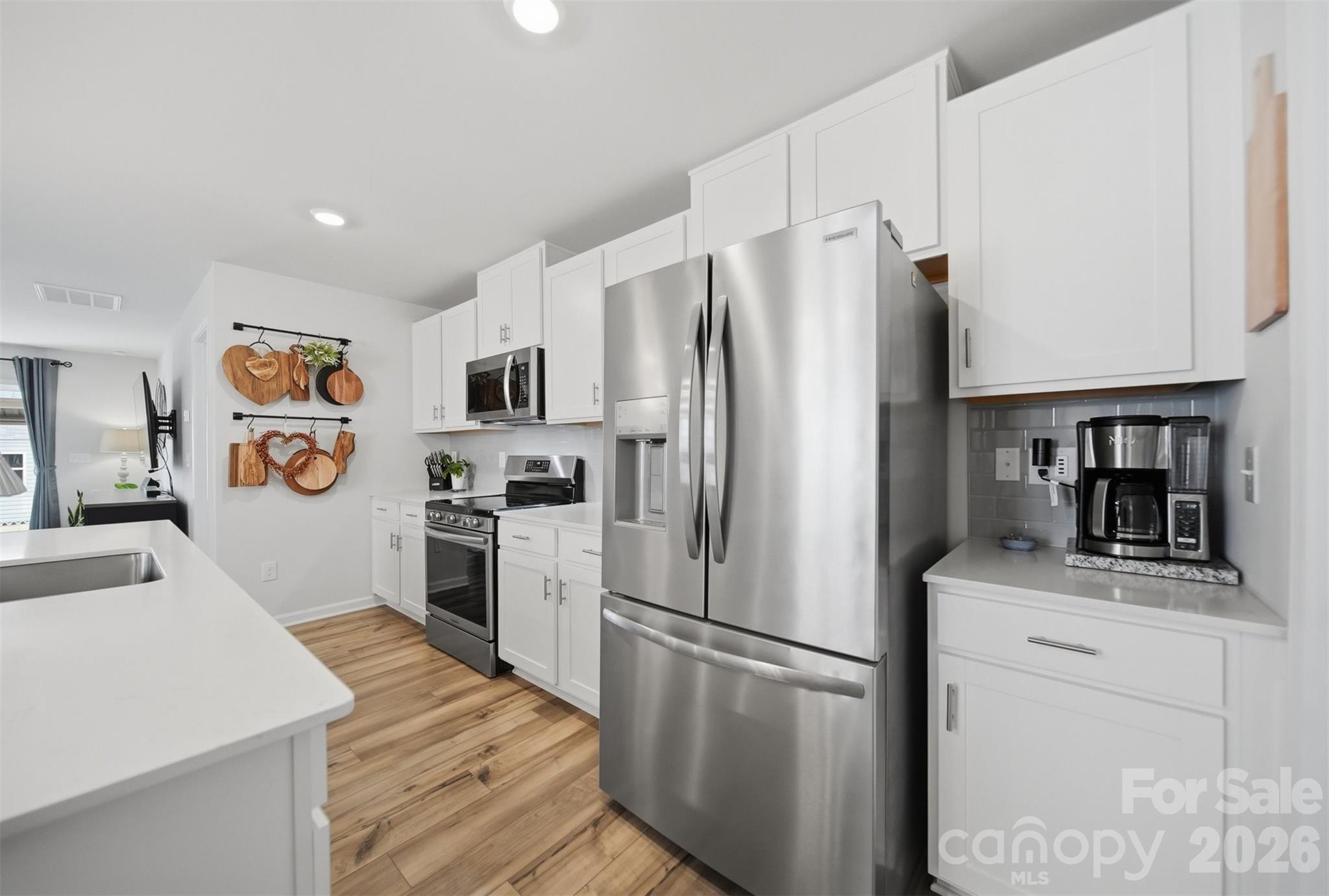 2841 Legacy Rdg Lane Catawba, NC 28609 - Photo 13 of 42 a kitchen with stainless steel appliances a refrigerator sink and microwave
