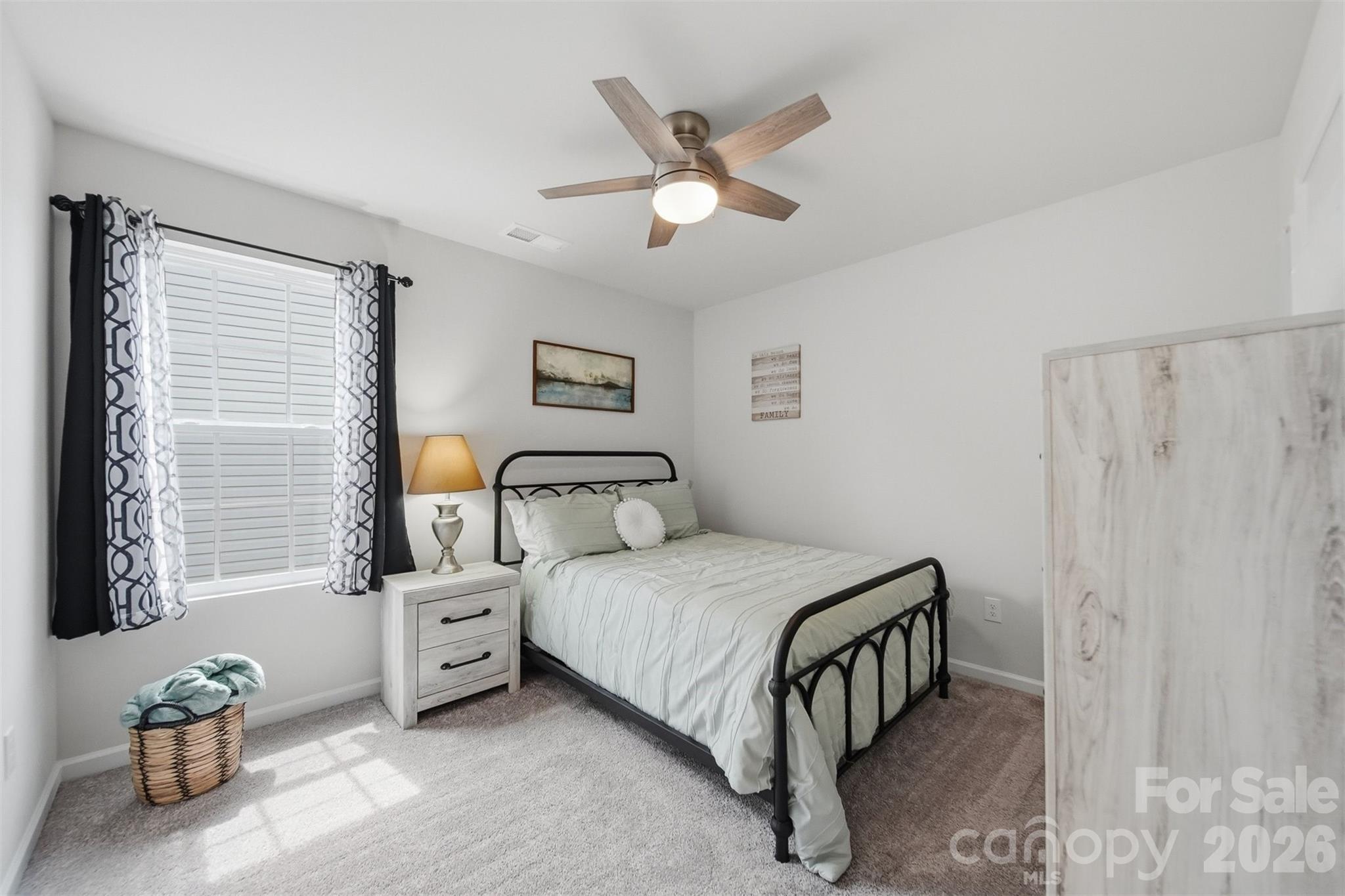 2841 Legacy Rdg Lane Catawba, NC 28609 - Photo 30 of 42 a bedroom with a bed and a chandelier