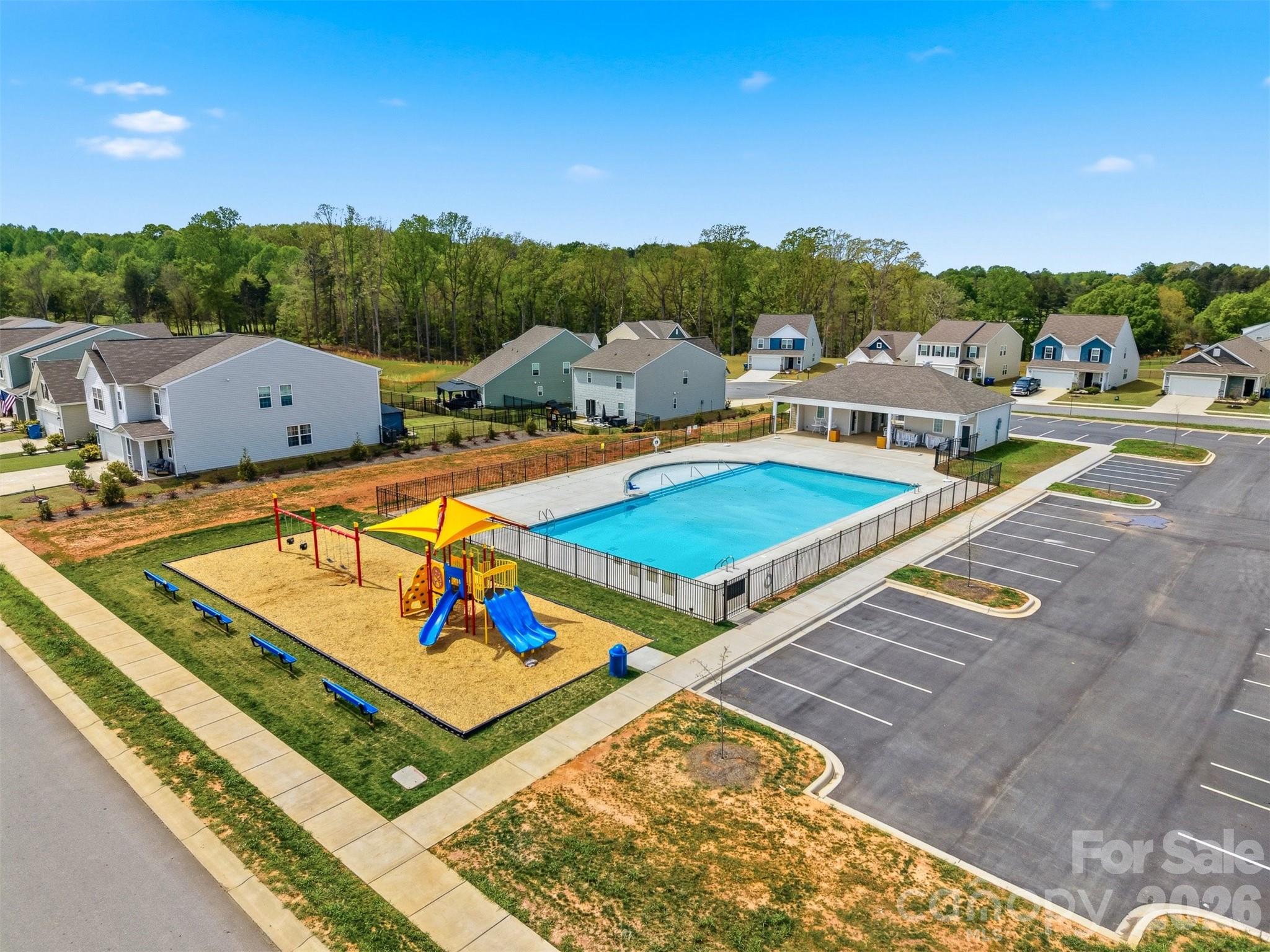 2841 Legacy Rdg Lane Catawba, NC 28609 - Photo 40 of 42 a view of swimming pool with seating area and trees in the background