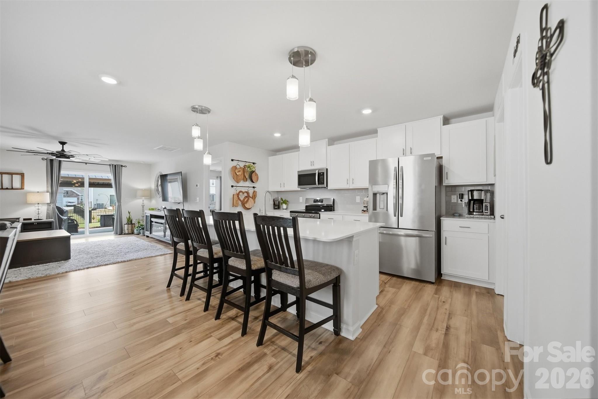 2841 Legacy Rdg Lane Catawba, NC 28609 - Photo 10 of 42 a kitchen with stainless steel appliances a refrigerator a stove top oven a sink dishwasher and white cabinets with wooden floor