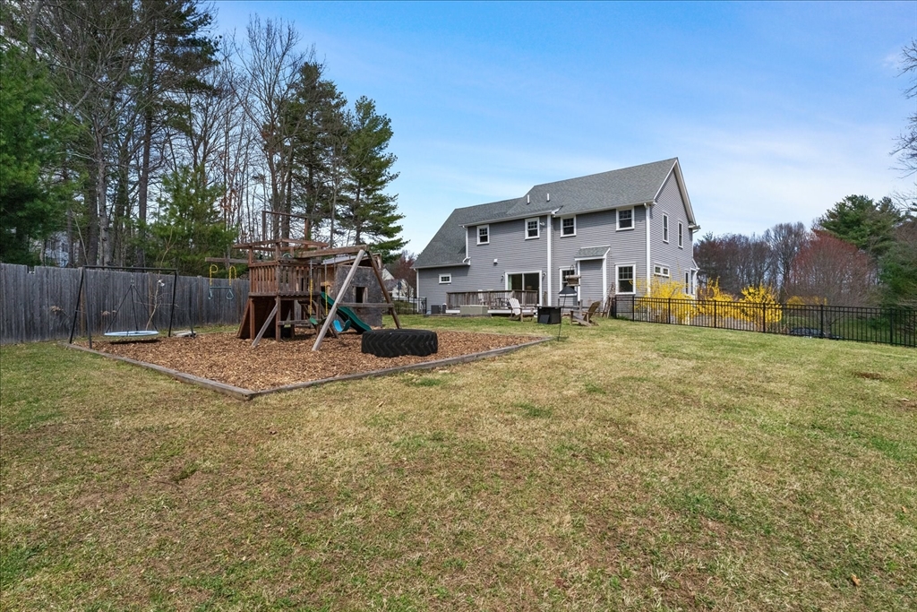 50 Quabbin Path Sutton, MA 01590 - Photo 37 of 42 a view of a house with backyard and a tree
