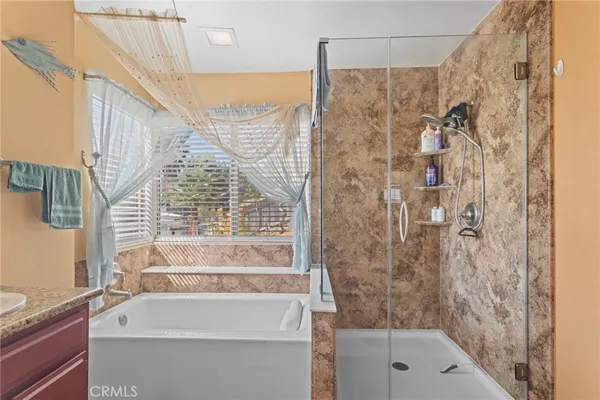 a bathroom with a bathtub and a shower