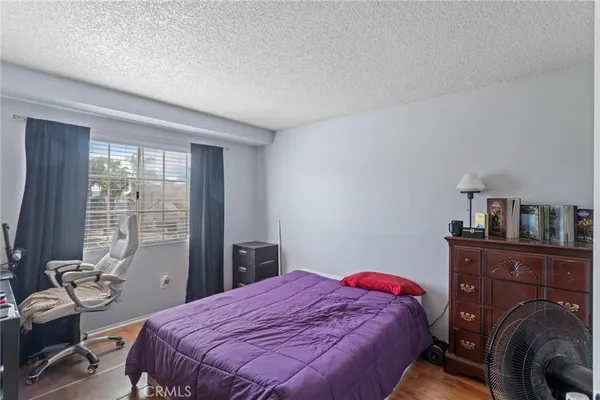 a bedroom with a bed and a table in it