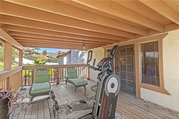 a view of a chairs and table in patio