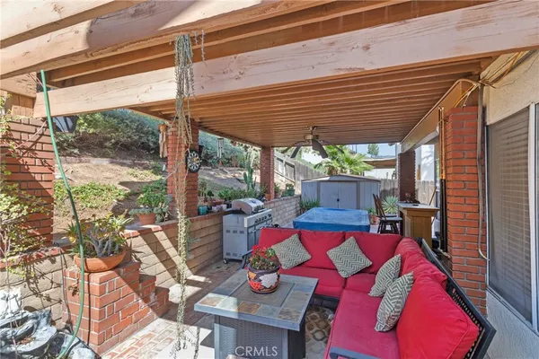 a view of a chairs and table in patio