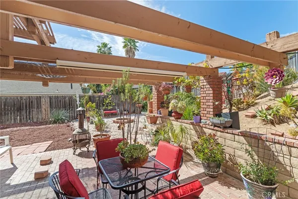 a view of a chairs and tables in patio