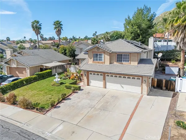 an aerial view of a house with a garden