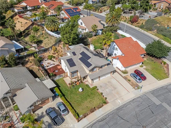 an aerial view of a house with a garden