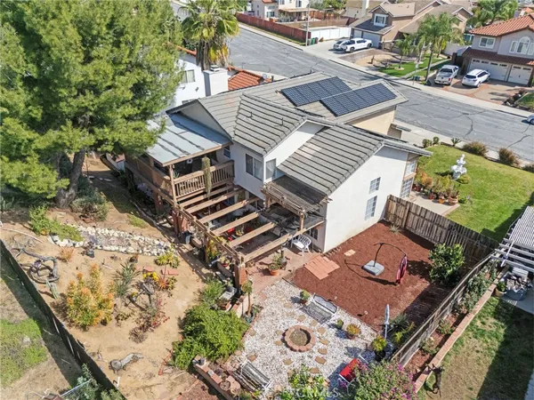 an aerial view of a house with a garden