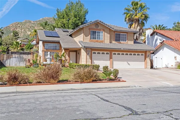 front view of a house with a street