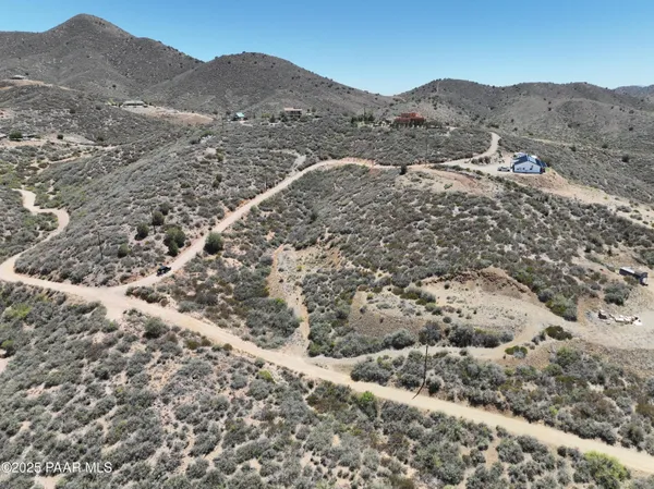 a view of a mountain range with trees