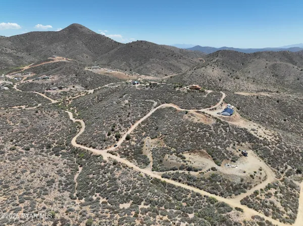 a view of a mountain with a mountain in the background