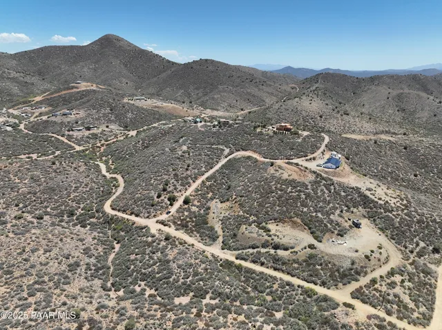 a view of a mountain with a mountain in the background