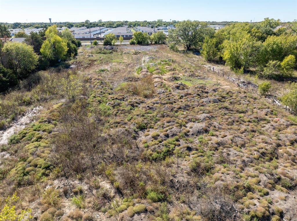 2033 Vinson Road Wylie, TX 75098 - Photo 3 of 7 a view of a yard with a tree