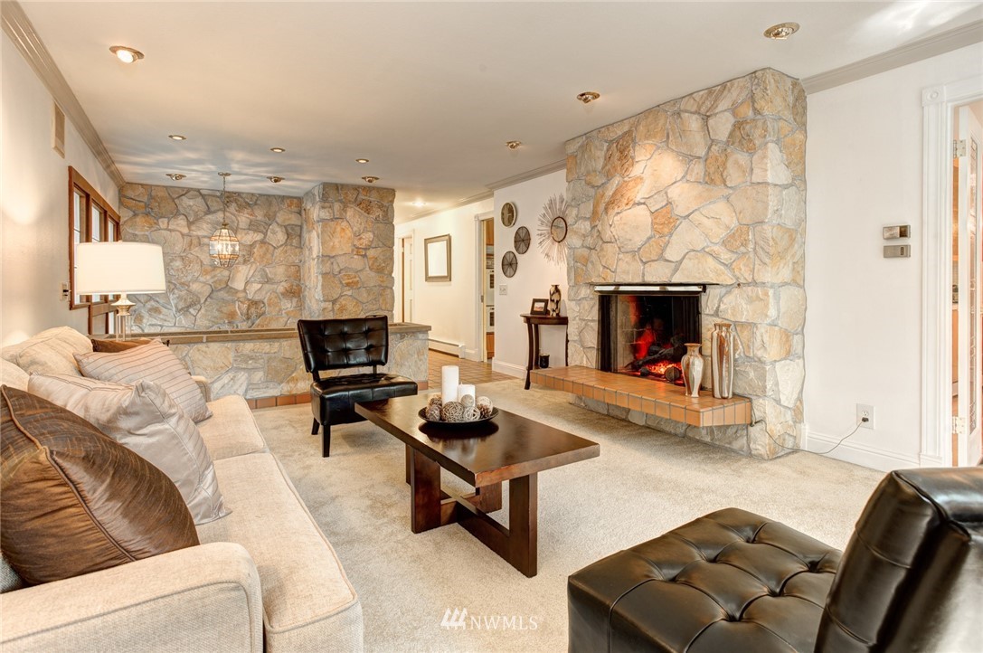 2347 North 64th Street Seattle, WA 98103 - Photo 2 of 25 a living room with furniture and a fireplace