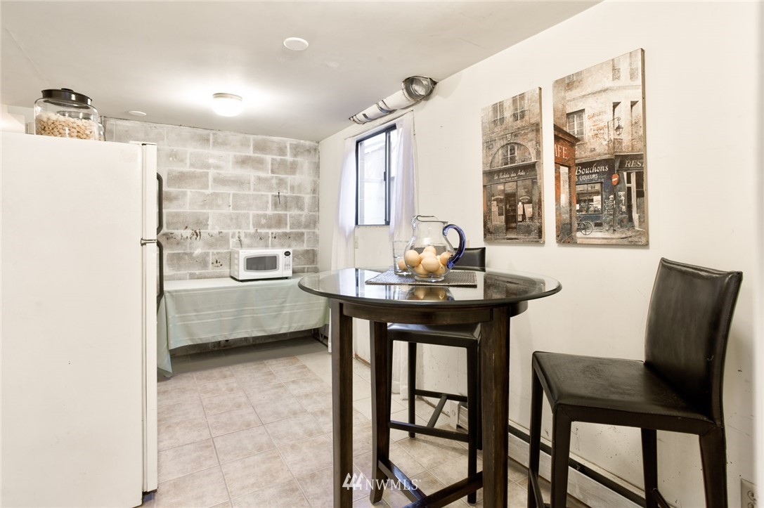 2347 North 64th Street Seattle, WA 98103 - Photo 16 of 25 a view of a dining room with furniture and window