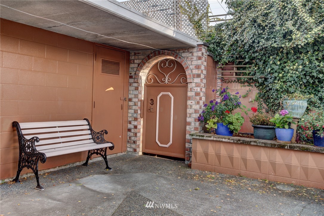 2347 North 64th Street Seattle, WA 98103 - Photo 23 of 25 a front view of a house with a garden