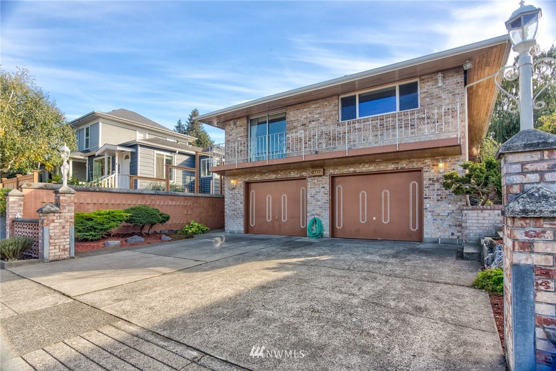 2347 North 64th Street Seattle, WA 98103 - Photo 25 of 25 a front view of a house with a garden