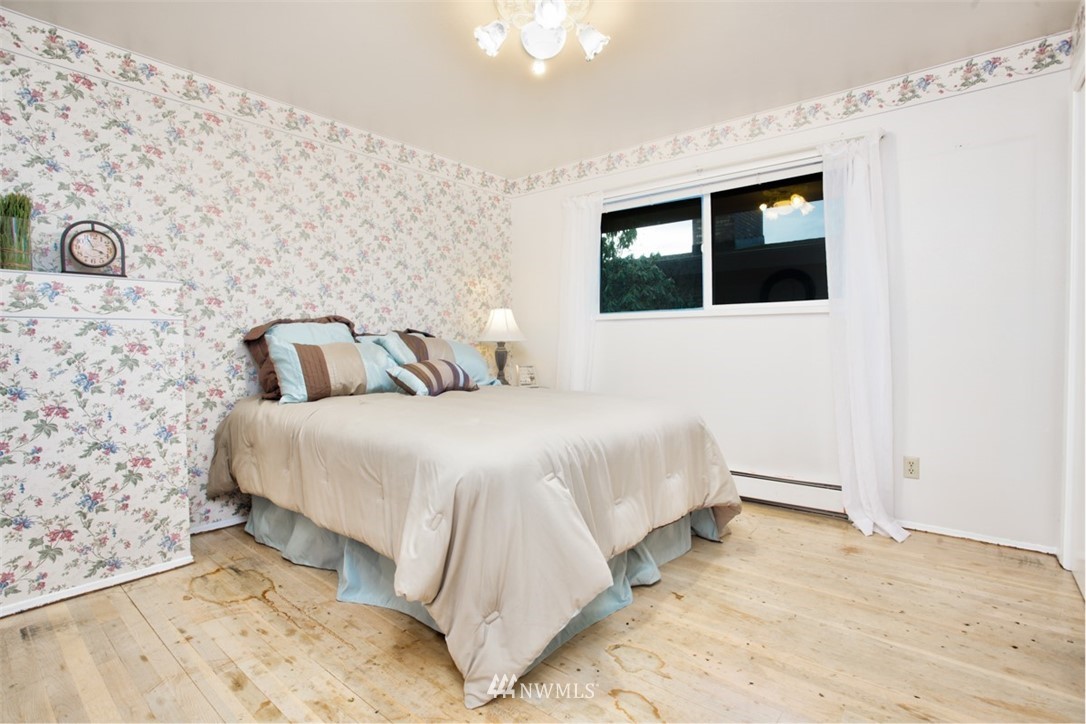 2347 North 64th Street Seattle, WA 98103 - Photo 9 of 25 a bedroom with a bed and a window