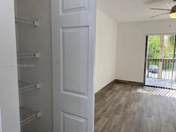 a view of an empty room with a window